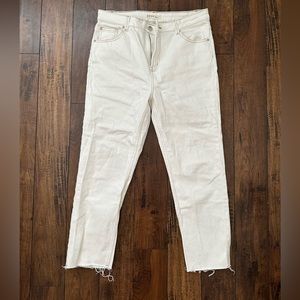 white jeans with brown stitching